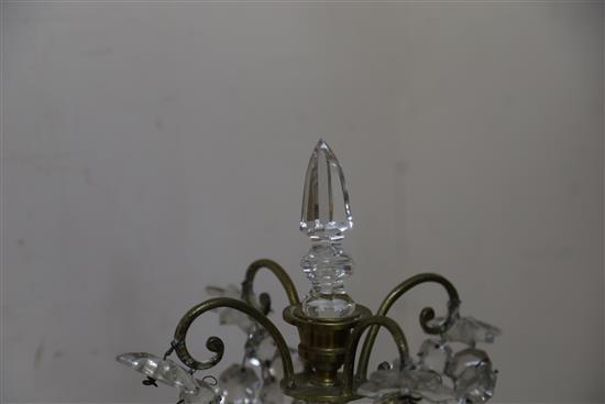 A pair of late 19th century Bohemian brass and lustre hung four branch candelabra, height 60cm (break to stem of one)
